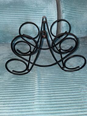 Black wrought iron wine bottle holder (holds four bottles)